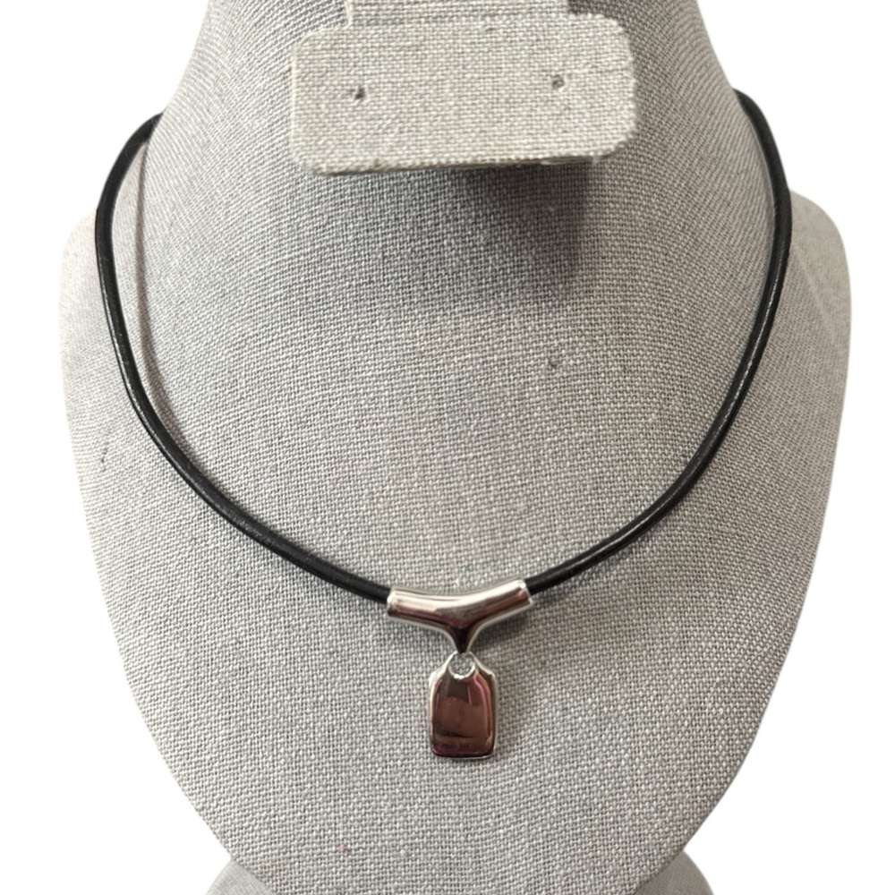 Retired Lia Sophia "Anew" silver-tone slide pendant necklace on a black cord